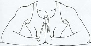 Figure drawing of wrist flexor exercise with palms together and forearms on table.